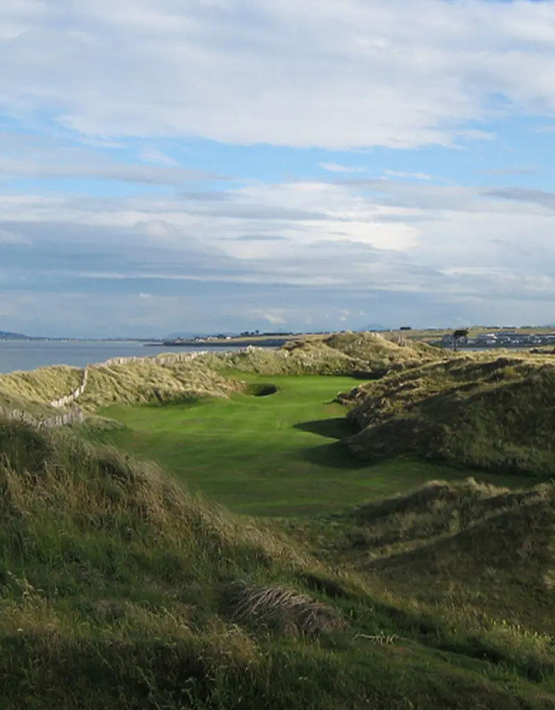 Narrow view of green through hills